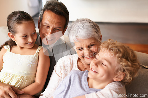 Image of Hug, grandparents and grandchildren with smile for family, photo and multi generation bonding. Senior couple, boy and girl with laugh, love and happiness for playful relationship together at home