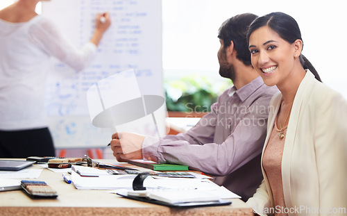 Image of Portrait, smile and presentation with business woman in boardroom of office for meeting or training. Education, learning and upskill development with happy young employee in company workplace