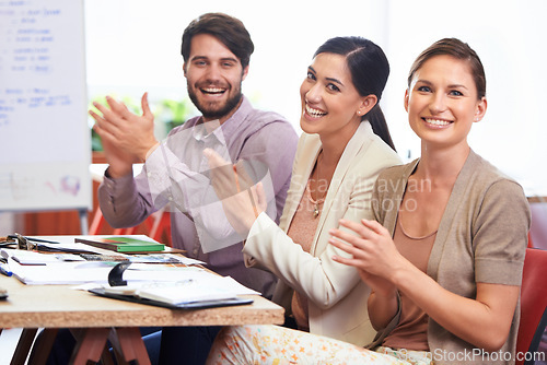 Image of Colleagues, portrait and clapping with happiness for success, growth and achievements for team at staff meeting. Business, people and applause for good feedback, targets and cheering for employees