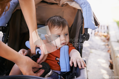 Image of Baby, pram and outdoor for park, hands and mother for walk and family time with child. Kid, stroller and mom in backyard, nature and toddler for development and safety for stroll after day care