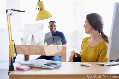 Image of Colleagues, office and working on computer, smile and in work space. Collaboration, journalist or writer at newspaper company, technology and magazines with communication between news bloggers