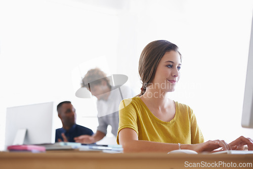 Image of Woman, computer and desk in office for professional work, creative research or planning. Copywriter, editor or designer with technology and web at workstation for online at company or corporation