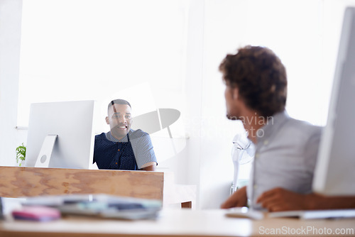 Image of Businessmen, talking and computers in office for planning, collaboration and brainstorming at desk. Diverse people and web designers with tech for conversation, projects, ideas or online research