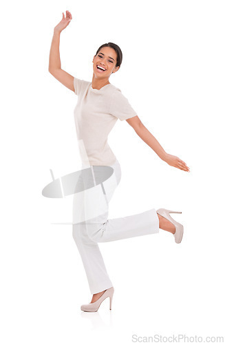 Image of Woman, excited and celebration in studio for success, winning and achievement with fashion, bonus or sale. Portrait of a winner or happy model in heels with wow, jump or yes on a white background