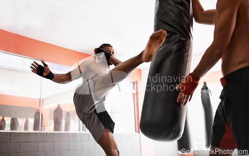 Image of MMA, kickboxing and man training for competition with personal trainer in gym, sport and practice with warrior. People, fitness and workout for challenge, exercise and person healthy for danger