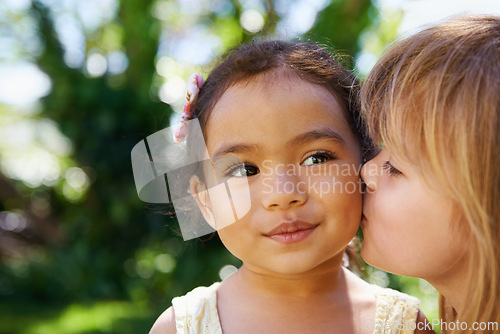 Image of Closeup, little children and cheek kiss in nature for fun, playing and bonding outside. Affection, outdoors and friendship with girl kids face for vacation or holiday in Sydney, Australia in summer