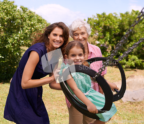 Image of Swing, portrait and smile with family at park for holiday, playful and playground game together. Happiness, summer and vacation with women and pushing child in nature for relax, bonding and love