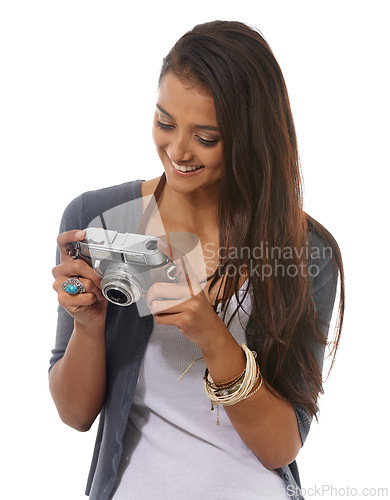 Image of Woman, photographer and vintage camera in studio, smile and pride for picture or production. Female person, retro equipment and confident for job on white background, photoshoot and happy for hobby