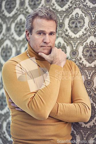 Image of Man, portrait and confident with retro fashion for 70s, old school and clothes for unique style. Male person, mature and vintage outfit with serious, classic look and antique trendy wallpaper