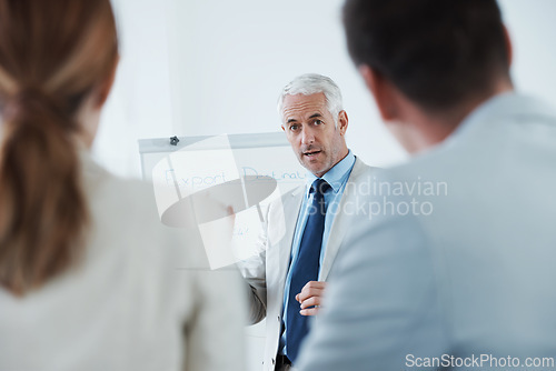 Image of Mature, man and meeting with training in presentation for business, coaching and mentor with advice. People, learning and speaker in seminar for teaching team, strategy and businessman explain plan