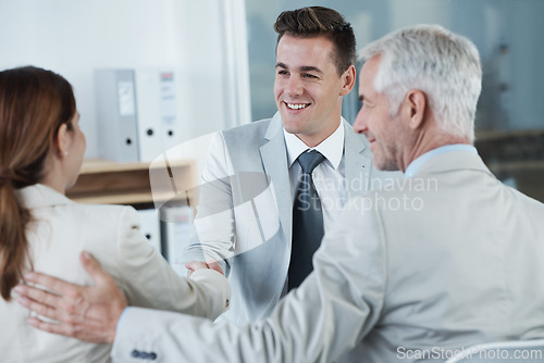 Image of Happy, handshake and hr with candidate in office for business meeting, discussion or recruitment. Smile, hiring and man talking to professional human resources managers in workplace boardroom.