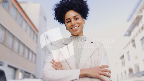 Image of Woman, portrait and arms crossed in street for mission, motivation or mindset with confidence in city. Entrepreneur, employee and female person with smile for business, success or satisfaction