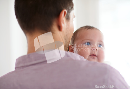 Image of Family, baby and dad back at home with love, support and care together with parent and bonding. Relax, father and happy in a house with hug of a calm infant with childcare and smile with a young girl