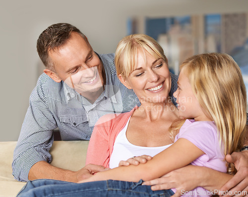 Image of Relationship, child or parents on couch with love, relax or bonding together for peace on weekend. Father, mother and daughter for happy family with care, vacation and excited with hugging in lounge