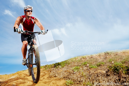 Image of Nature, cyclist and man athlete with bicycle in park for marathon, race or competition training. Fitness, sports and male person cycling on bike for cardio workout or exercise in outdoor forest.