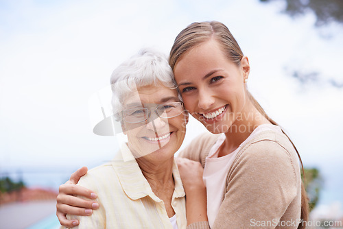 Image of Hug, family and portrait of senior mother with daughter embrace for bonding, relationship and love. Happy, retirement and face of elderly parent with woman for care, affection and relaxing outdoors