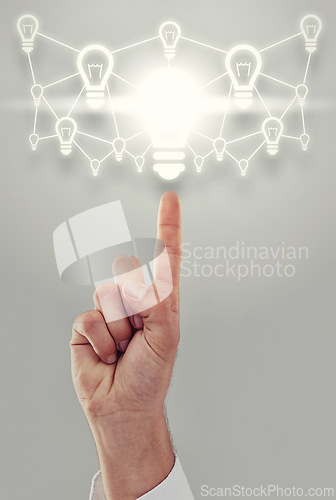 Image of Hand, light bulb and digital transformation for business growth and development on grey background. Person with networking ideas, corporate innovation and knowledge with enlightenment and inspiration