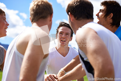 Image of Men, group and huddle for sport on field with motivation, support and cheer for challenge with fitness. People, team building and circle with solidarity for contest, competition or workout in game