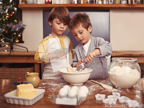 Image of Boys, baking and playing in home with flour, love and bonding with ingredients for dessert cake. Children, mixing or bowl for christmas cookies on counter, eggs or learning of pastry recipe by cutter