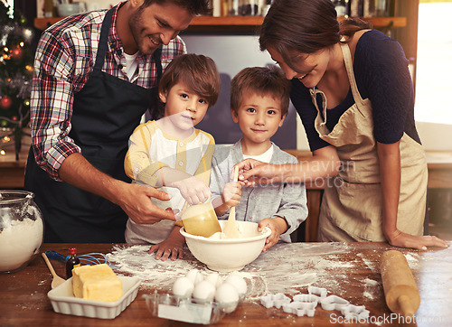 Image of Family, smile and portrait of kids baking in kitchen, learning or happy boys bonding together with parents in home. Father, mother or face of children cooking with flour, dessert or teaching brothers