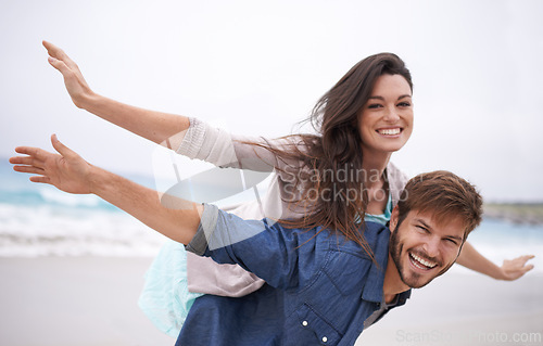 Image of Airplane, happy and couple with piggyback on beach in summer for love, travel and freedom on vacation in California. Portrait, ocean and face with smile for fun on holiday, trip or adventure together