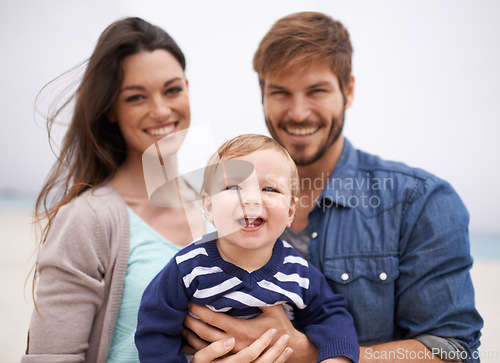 Image of Mother, father and portrait with toddler at beach for family, love and adventure together on vacation. Happy, man and woman with baby by ocean for support, travel and relaxing holiday in Los Angeles