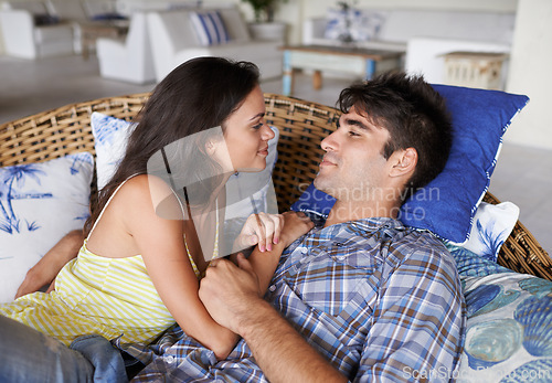 Image of Couple, relax and romantic at home for love, relationship and spouse comfort for security. Man, woman and together in living room for bonding, commitment and cuddle in house for happiness and safety