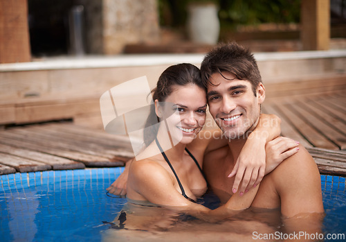 Image of Couple, portrait and swimming pool relax for travel vacation in Hawaii for honeymoon holiday, bonding or stress relief. Man, woman and embrace for hotel weekend in summer for trip, outdoor or peace