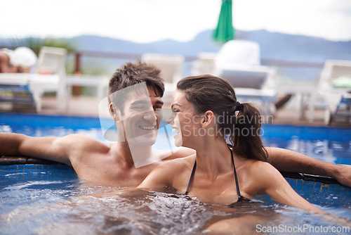 Image of Couple, smile and swimming pool relax for travel vacation in Hawaii for honeymoon holiday, bonding or stress relief. Man, woman and embrace for hotel weekend in summer for trip, outdoor or peaceful