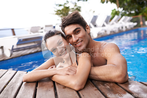 Image of Couple, portrait in pool and hug outdoor, love and connection with summer vacation at resort or hotel. Happy people, swimming or relax in jacuzzi for romantic date or getaway with trust and bonding