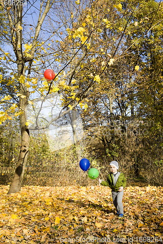 Image of beautiful boy with balloons