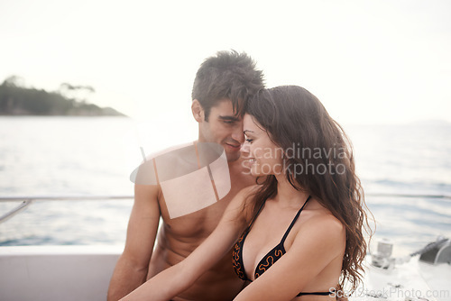 Image of Love, happy and couple at ocean on boat for vacation, holiday or travel together in summer. Man, woman and smile at sea on ship for connection, relax or touch forehead on adventure by water outdoor