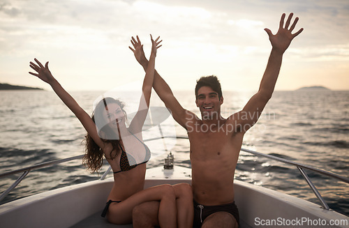 Image of Freedom, portrait and couple in a boat with sunset, happy with vacation and travel to Italy for nature and ocean. People on romantic adventure for love, bonding and transport with arms raised and joy