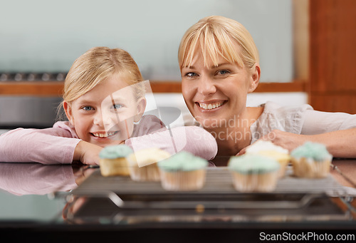 Image of Kitchen, cupcake and portrait with child and mom baking to relax in home together on holiday. Family, bonding and kid smile with mother, excited for eating cake, sweets or enjoy food in house