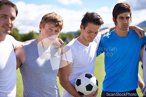 Image of Soccer, men and hug together on field for portrait at game with fitness, exercise and wellness in nature. People, teamwork and embrace for support, solidarity and football with friends in competition