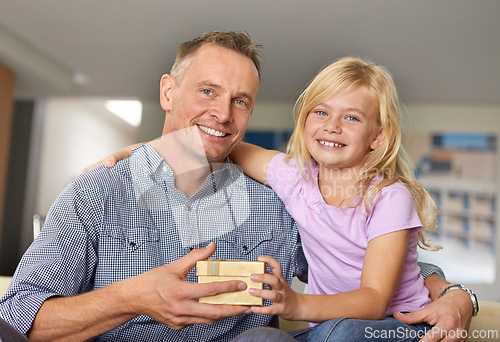 Image of Hug, father and child with present in home, portrait on birthday or giving a box for special event. Family, gift and offer dad gold package to show gratitude, love or kid with kindness in living room