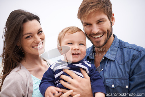 Image of Mother, father and portrait with toddler for family, love and adoption with happiness. Man, woman and face of parents with baby for domestic, support and bonding together on white background