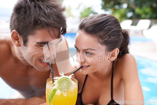 Image of Swimming pool, cocktail and couple with vacation, summer and weekend break with happiness and honeymoon. Sunshine, man and woman with tropical drink and wet with holiday and luxury with water and joy