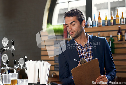 Image of Bar, stock or man with checklist for small business logistics, inventory or menu update on clipboard. Startup, reading pub info or manager writing sale price for an order in diner cafe or restaurant