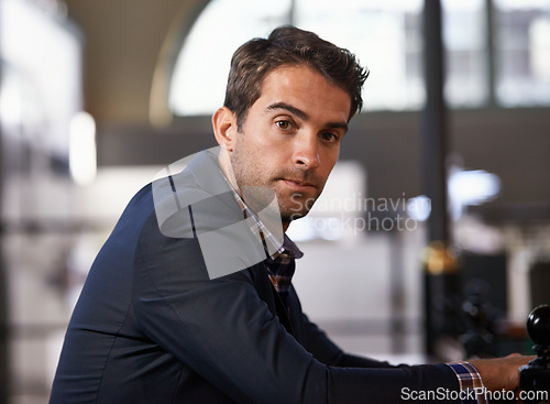 Image of Professional, businessman and portrait at desk in office as meeting, convention and event planner for hotels. Male person, entrepreneur and creative career for profession, job and client service