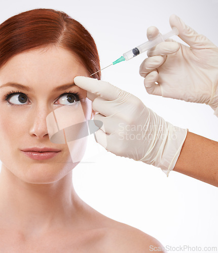 Image of Woman, hands and filler injection forehead or wrinkles as anti aging skincare procedure, dermatology or plastic surgery. Female person, fingers or syringe needle as studio, mockup or white background