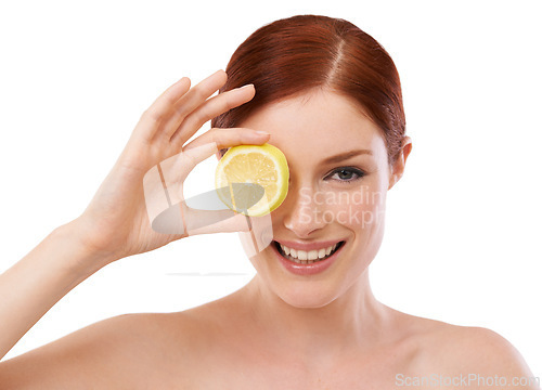 Image of Woman, smile and lemon for skincare in studio with beauty, glow or hydration benefit on white background. Portrait, cosmetic and face with citrus fruit for vitamin c, dermatology and self care