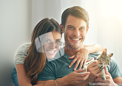 Image of Man, woman and kitten for portrait in home with hug for love, bonding and care for pet in living room. Couple, relax or pride with kindness, embrace and cat in lounge for animal adoption at house