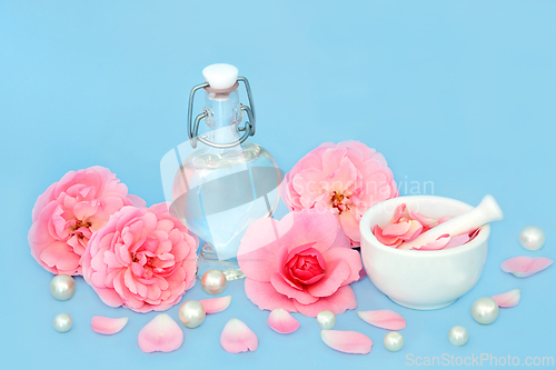 Image of Rose Flower Perfume Preparation with Pearls and Flowers