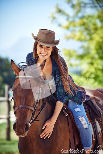Image of Portrait of woman, smile or horse riding on countryside farm as equestrian for training, sport or cowboy hat. Happy female person, saddle or western farming in Texas or environment, outdoor or stable