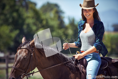 Image of Happy woman, portrait and cowgirl with horse in countryside for journey or outdoor adventure in nature. Female person or western rider with hat, saddle or mount on animal, stallion or pet at ranch