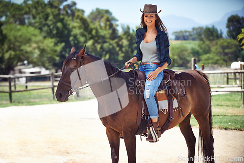 Image of Woman, portrait and horse or farm ranch in nature as equestrian or adventure sport, training or cowboy hat. Female person, saddle and western exercise in Texas or rural environment, outdoor or stable