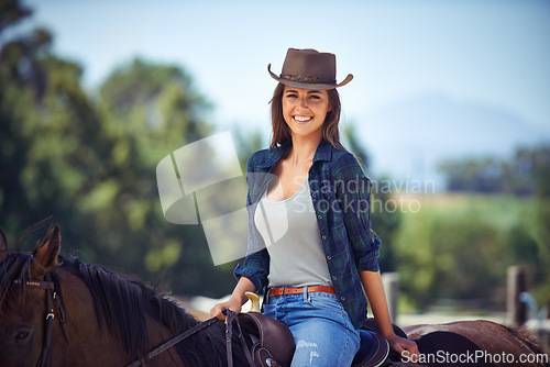 Image of Woman, portrait and horse or countryside nature as equestrian for adventure sport, training or cowboy hat. Female person, saddle and western exercise in Texas or ranch environment, outdoor or stable