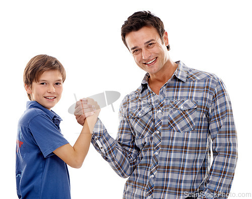 Image of Dad, portrait and arm wrestle with child for game of strength, power or playful bonding on a white studio background. Father, son or kid with handshake in battle for challenge, parenting or childhood