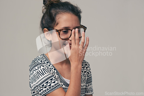 Image of Children, vision and glasses with happy little girl in studio isolated on gray background for optometry. Youth, frame and eyewear with young female kid at eye clinic for prescription eyesight test